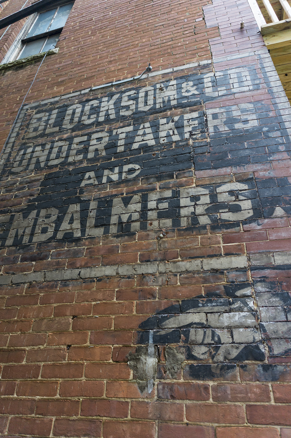 Photo of the historic Blocksom & Co. Undertakers and Embalmers sign in Eureka Springs, Arkansas. Photograph copyright 2019 by Keith Dotson, all rights reserved.