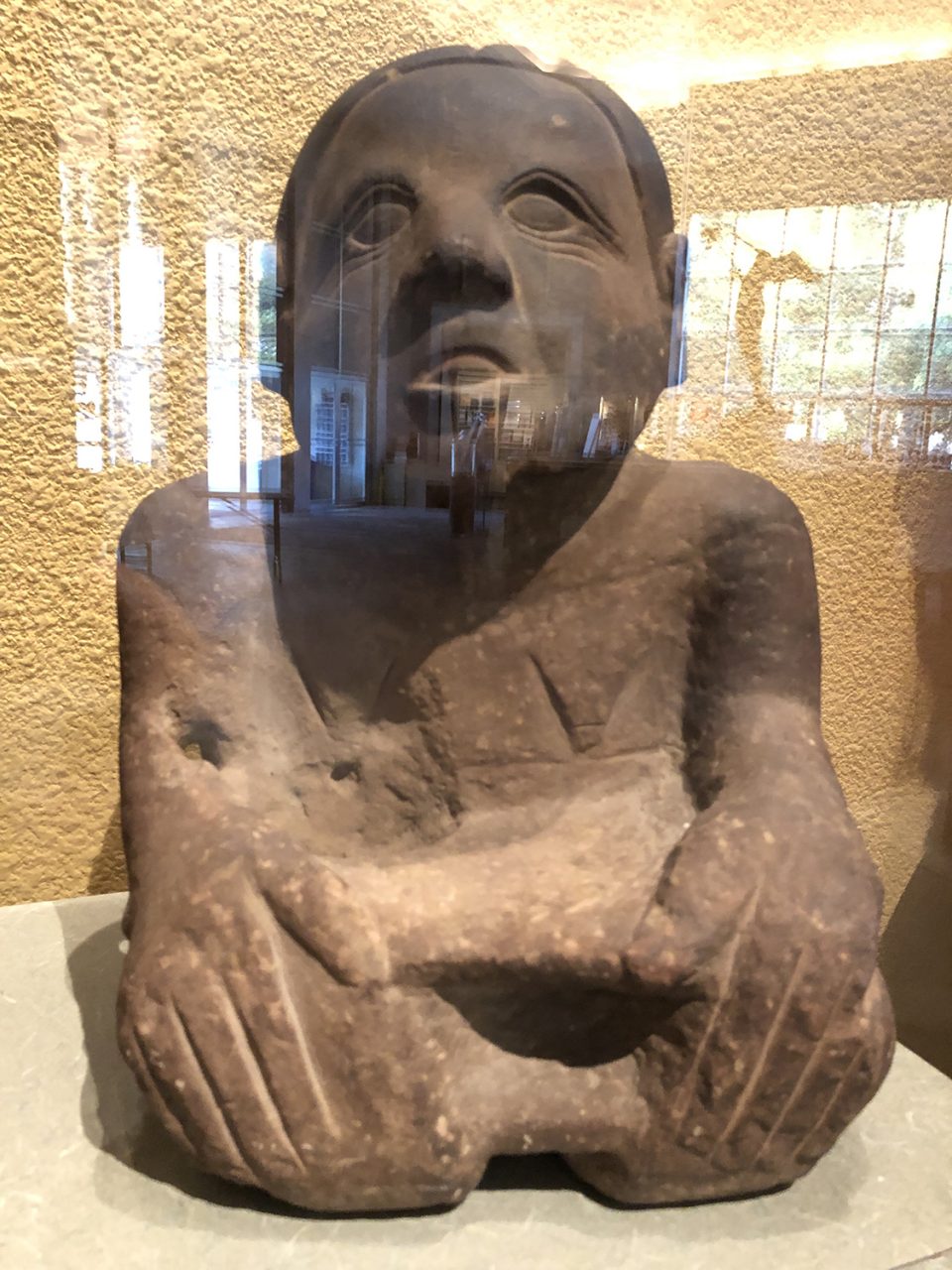 The female of the pair is carved of darker stone. Doesn't she have a sweet-natured, grandmotherly look in her eyes? The wrinkles and drooping breasts are indicators of age (wisdom?). The drilled holes may have held decorations or other perishable items.