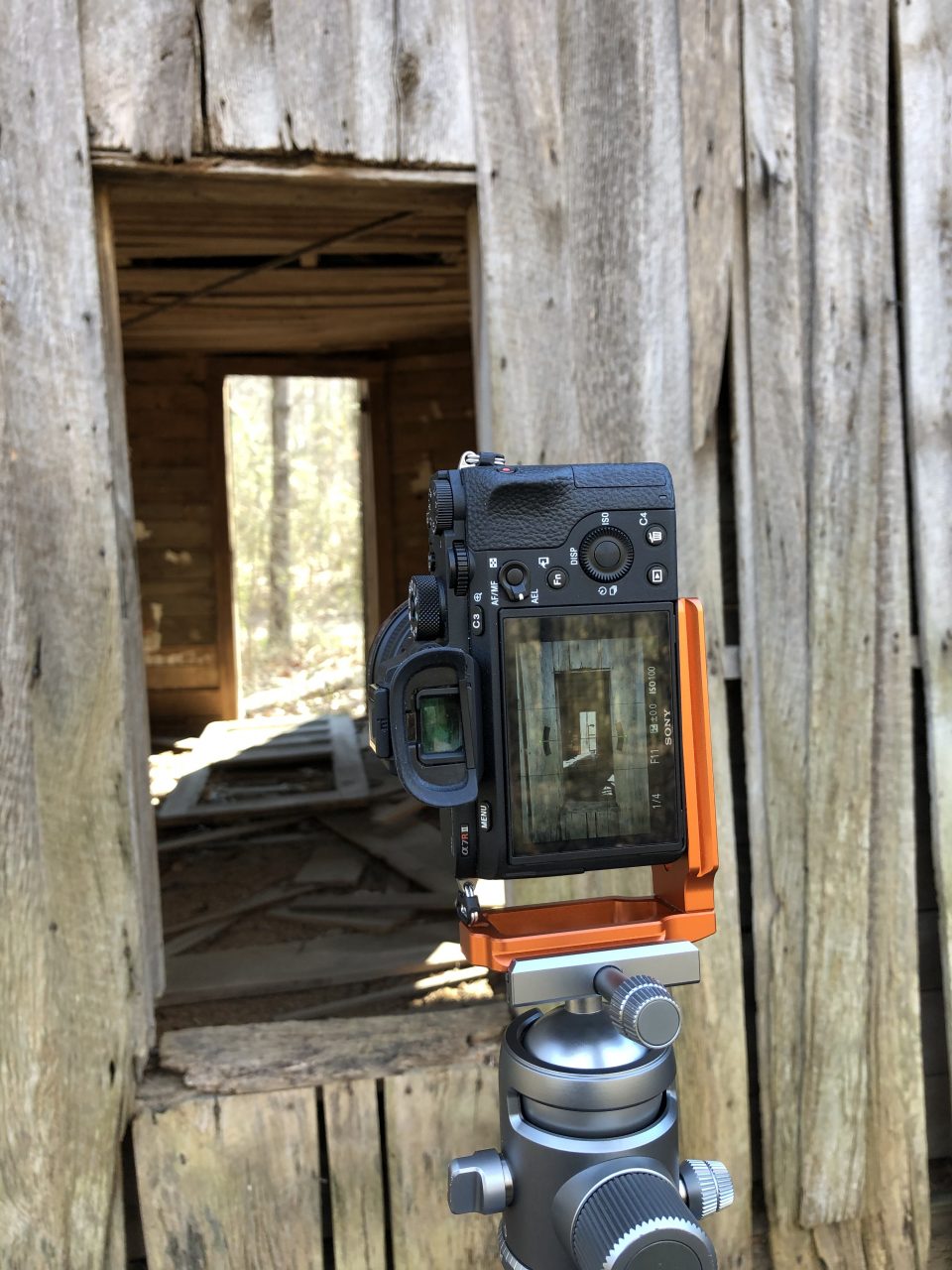 This photograph shows my camera in position to make a set of images of the window and the interior of the house, focused at various distances, and stacked later in Photoshop.