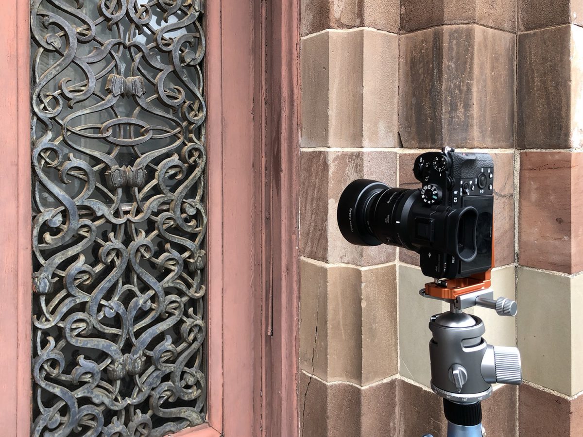 Camera on tripod to photograph the decorative ironwork on the front doors of the Farmers and Exchange Bank on East Bay Street in Charleston, South Carolina