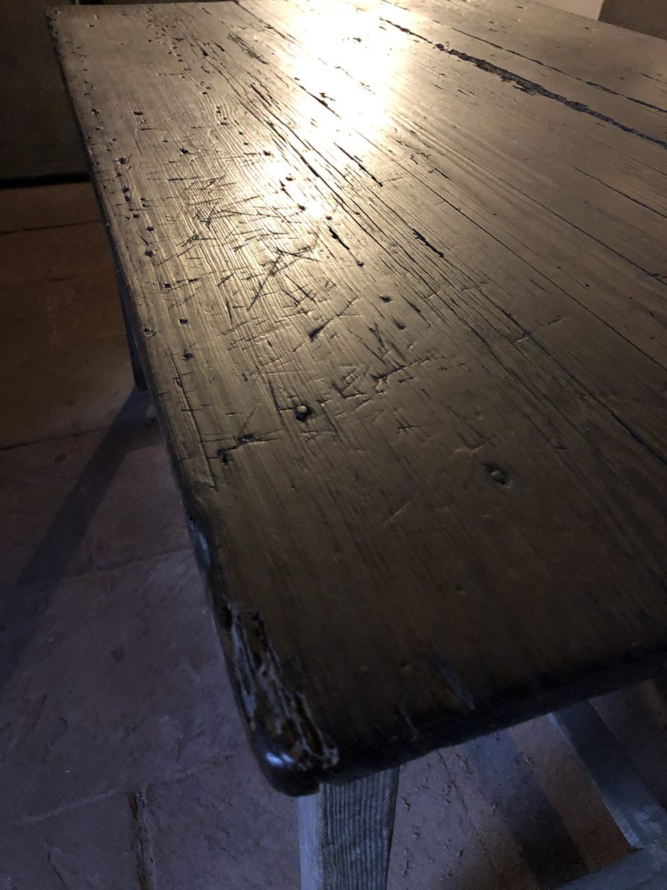 Marked surface of the old kitchen work table.