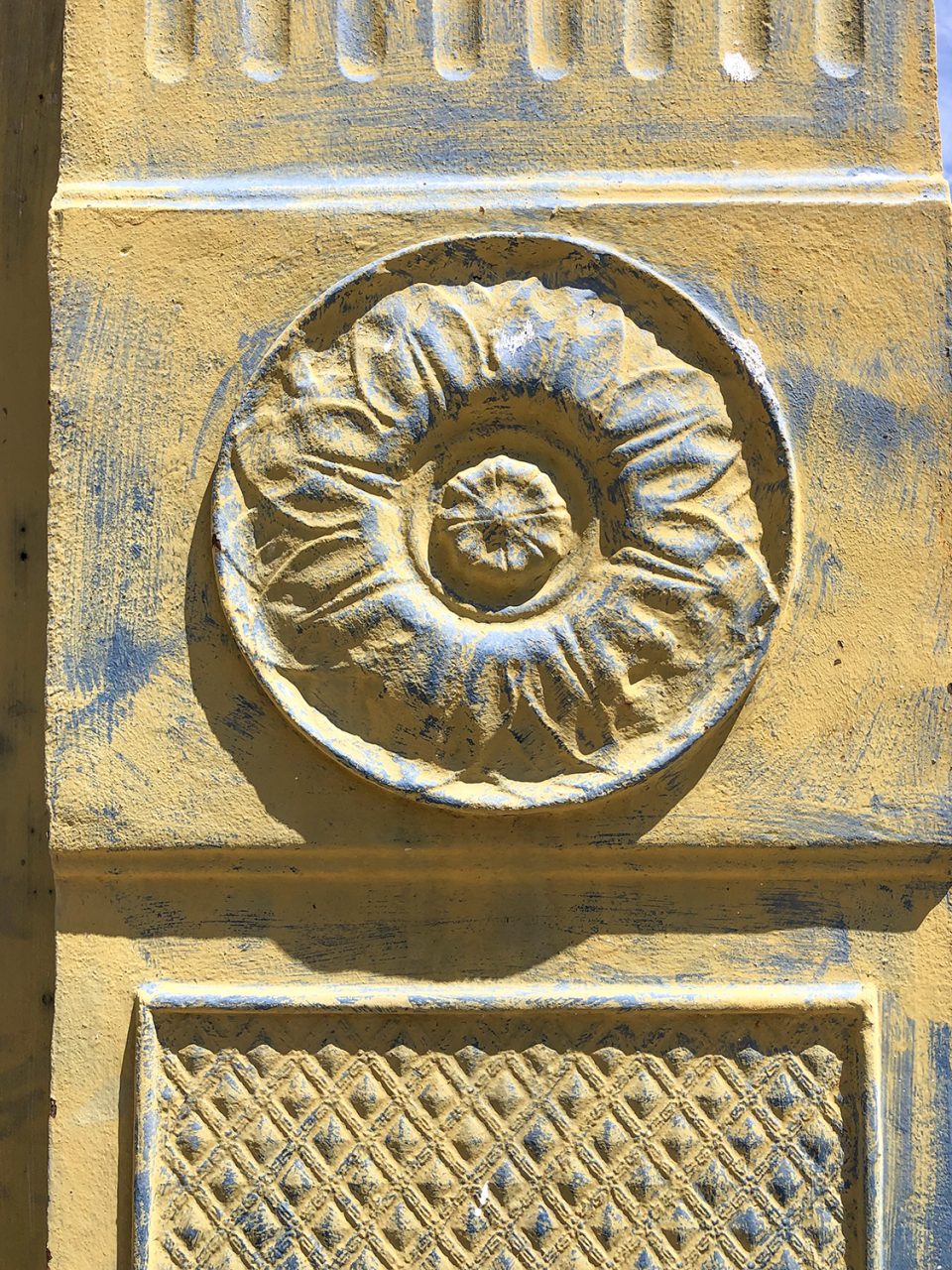A decorative rosette and diamond motif on the Chattanooga Roofing and Foundry Co. in Yazoo City, Mississippi.