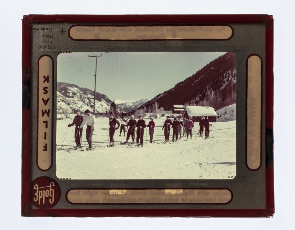 Vintage vacation slide: Cross country skiing in the mountains.