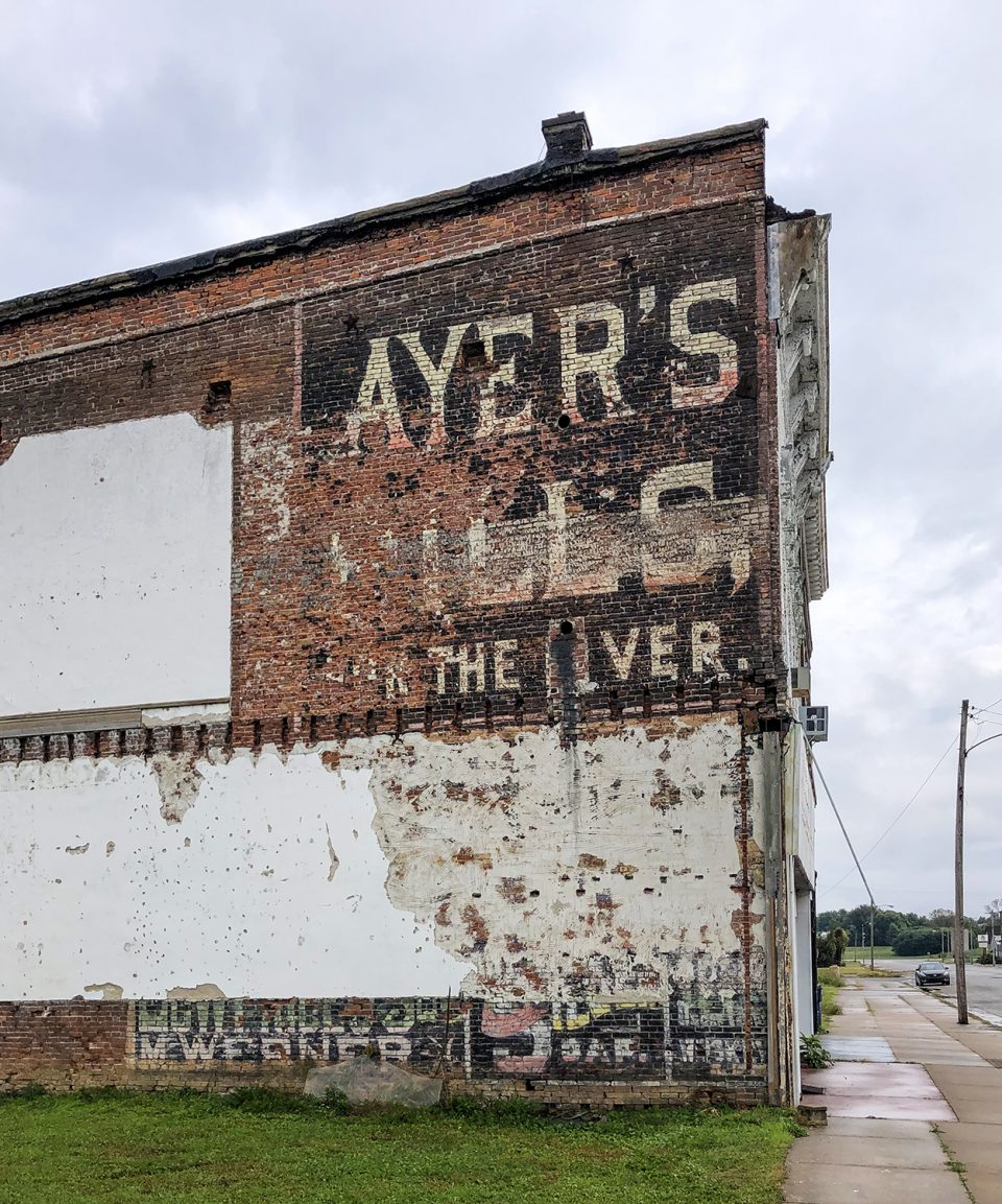 This historic wall ad for "Ayer's Pills for the Liver," has survived because it was hidden beneath the walls of an adjoining building for many decades.