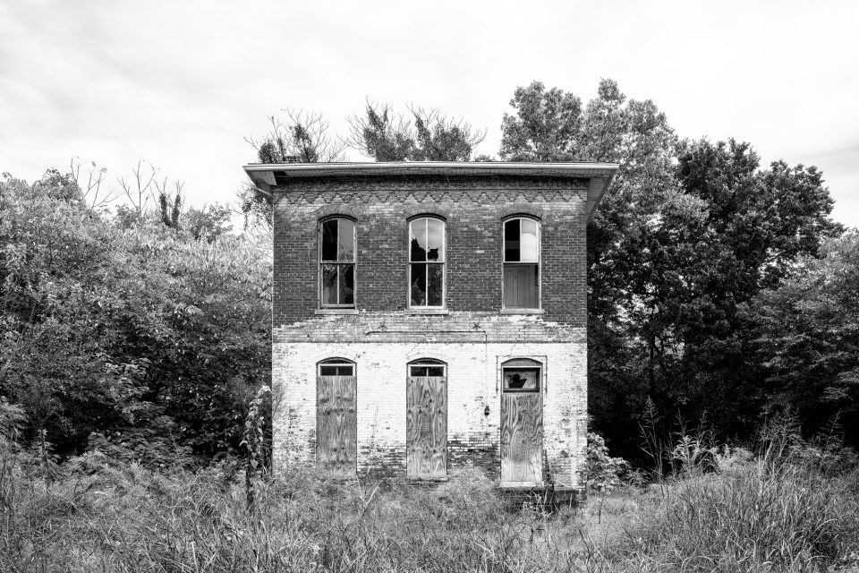 Abandoned Historic House in Cairo, Illinois. Black and White Photograph by Keith Dotson. Click to buy a fine art print.