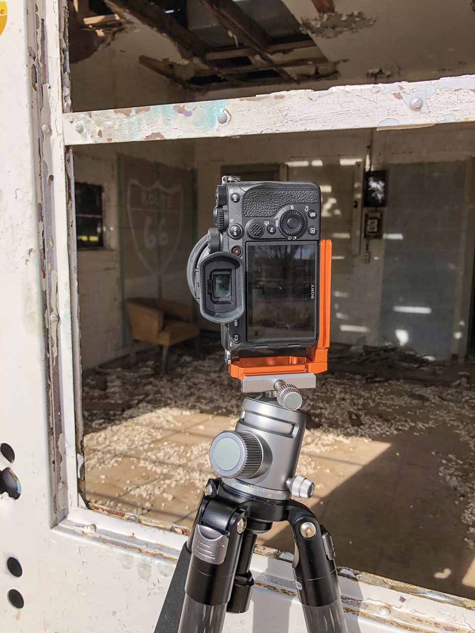 Behind-the-scenes image of my camera shooting a chair inside the abandoned Texas Longhorn Motel building on Route 66 in Glenrio, Texas.