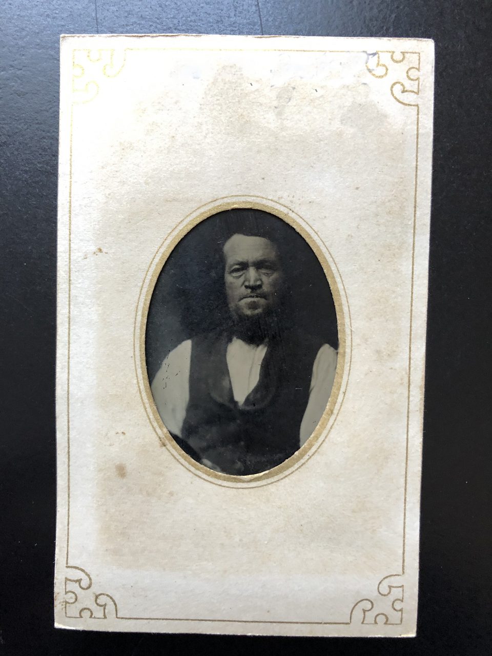 Small tintype portrait of unidentified man by an unidentified photographer.