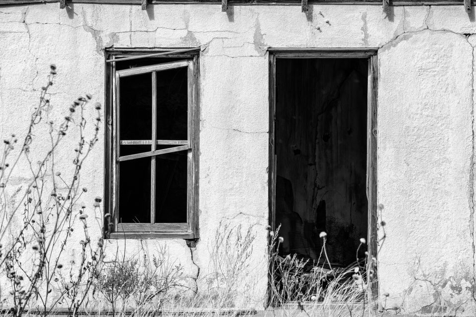 Open door and window of a room in the abandoned State Line Motel on the New Mexico side of Glenrio, built 1930.