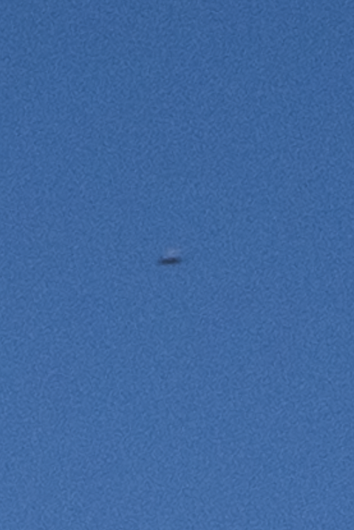 A much enlarged section of the color photograph, showing the object in the sky. Photograph copyright 2022 by Keith Dotson.