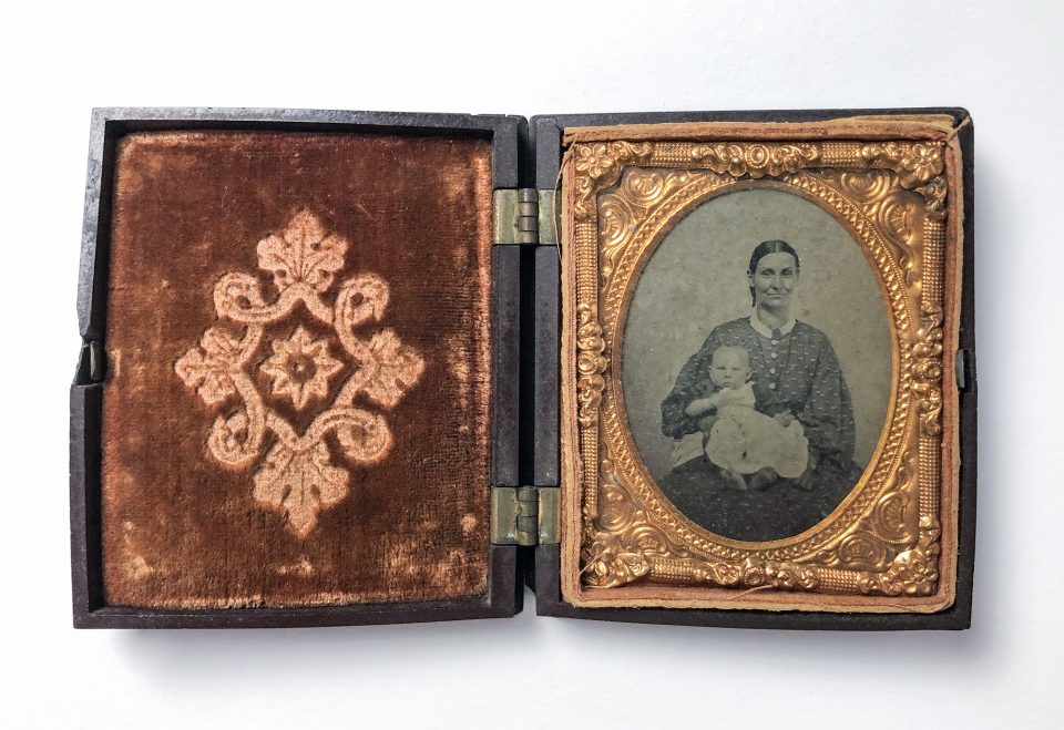 Tintype portrait of a mother and child in a beautiful thermoplastic case, circa 1860s.