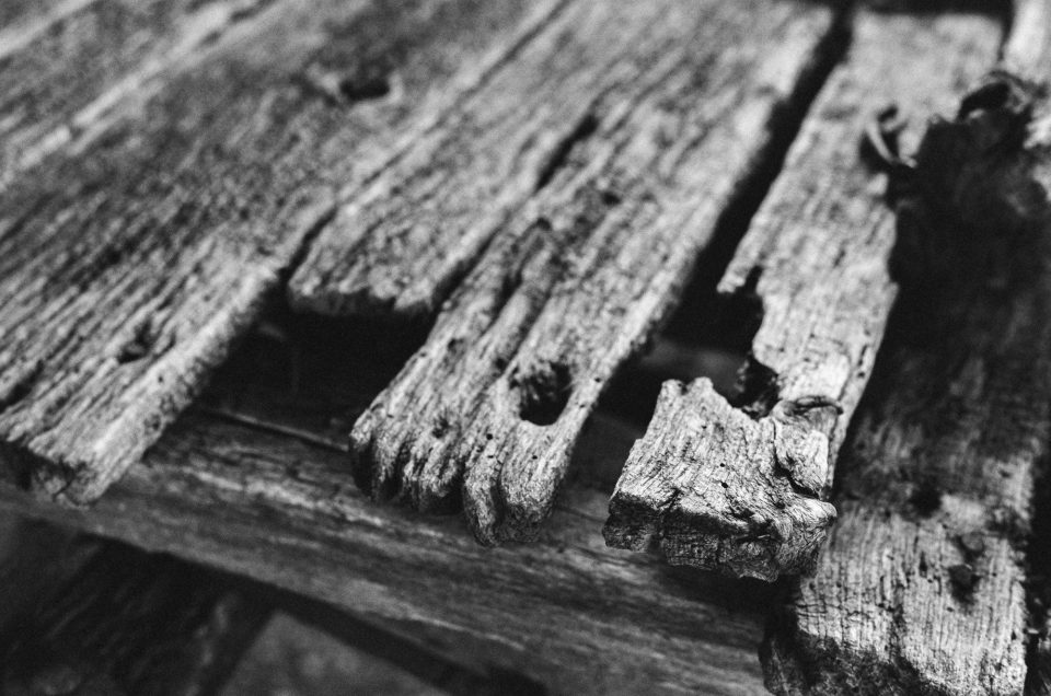 Photograph of weathered planks on an old wooden wagon by Keith Dotson. Shot on Kodak Tri-X black and white film using a 40-year-old Pentax K1000 camera and 50mm lens.