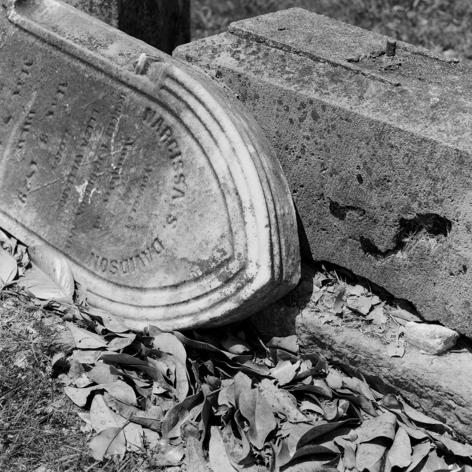 The broken headstone of Narcissa S. Davidson. Black and white photograph by Keith Dotson, shot with Hasselblad 500 C/M, with Cinestill Double X BwXX film.