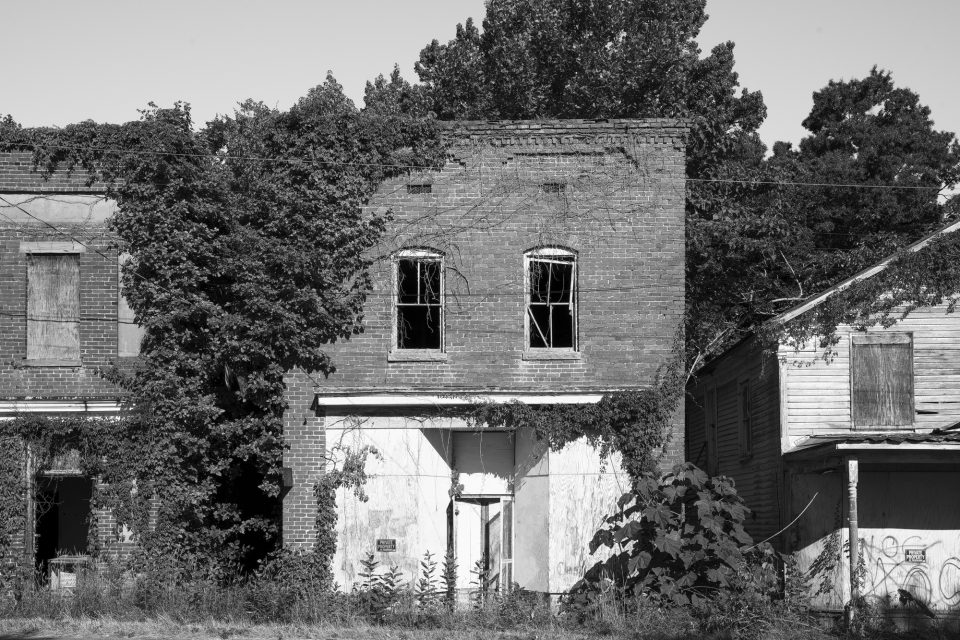 Black and white photograph of some of the abandoned storefronts in Union Level, Virginia