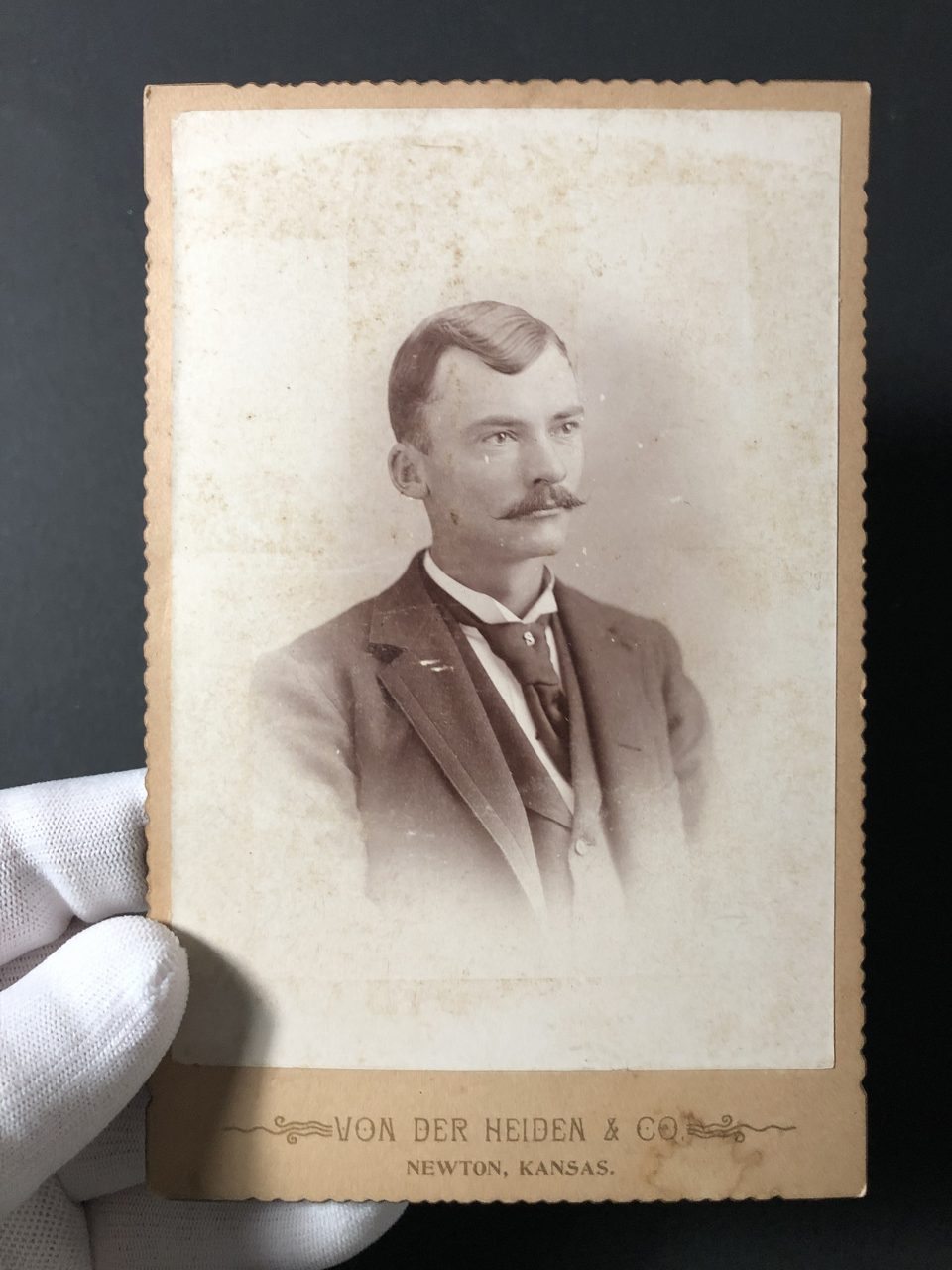 Cabinet card portrait of a young man likely taken in the 1880s by C.R. Von der Heiden in Newton, Kansas