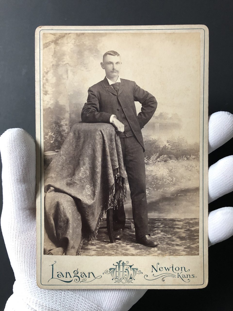 Full body portrait of an unidentified man made in the late 1880s by William E. Langan in Newton, Kansas