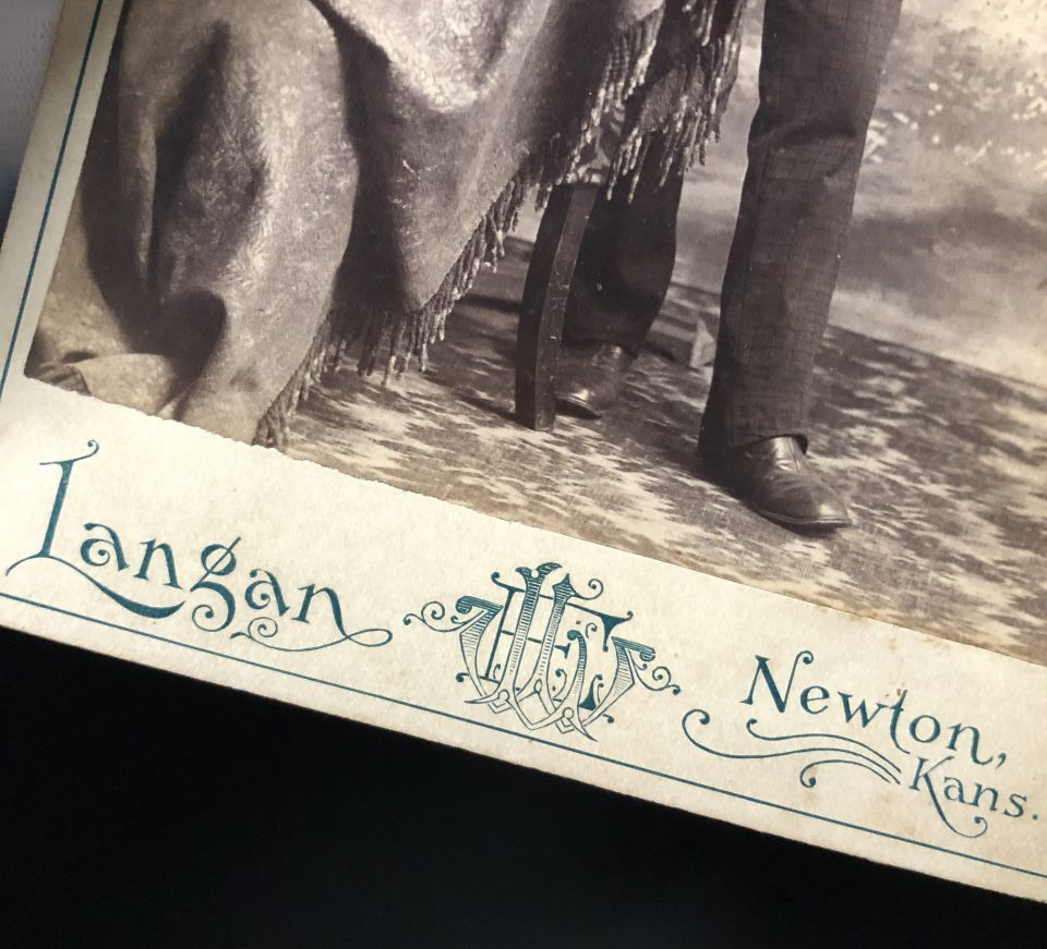 A close-up look at one of the many Langan nameplates found on the front of his cabinet cards.