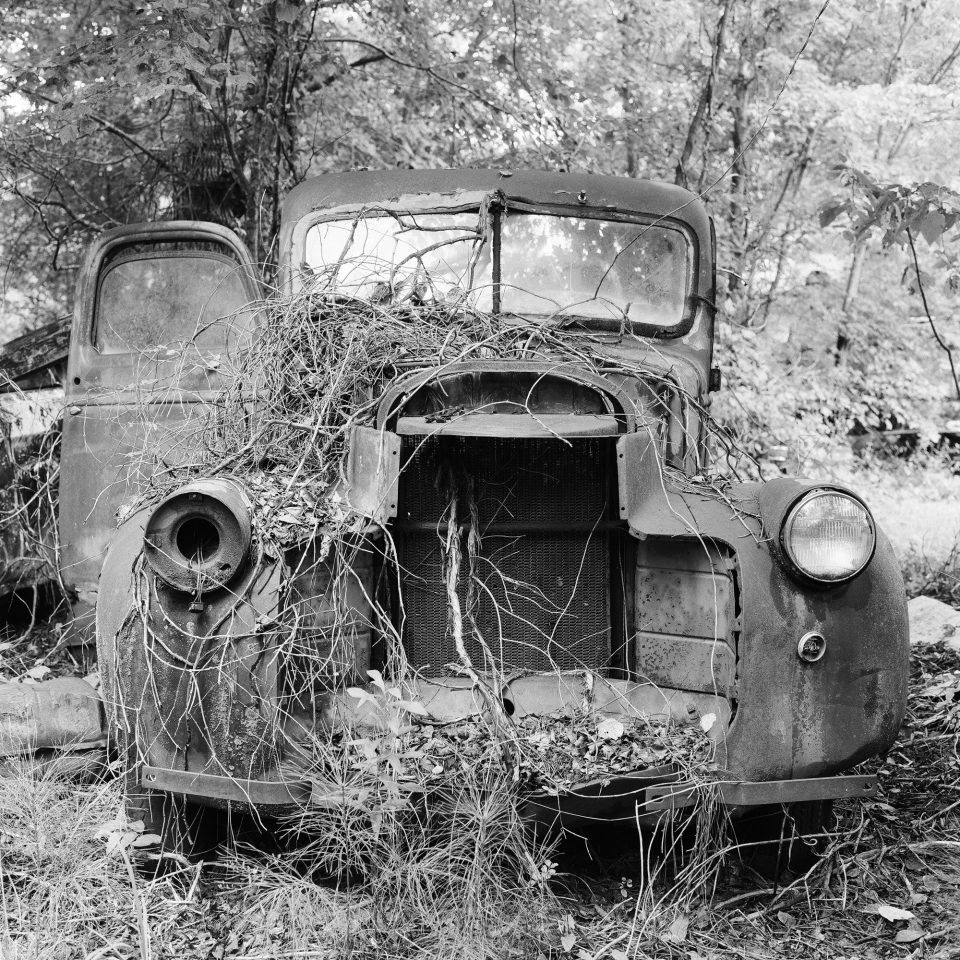 Rusty Junkyard Truck - Black and White Photograph (Square Format) by Keith Dotson. Buy a fine art print here.