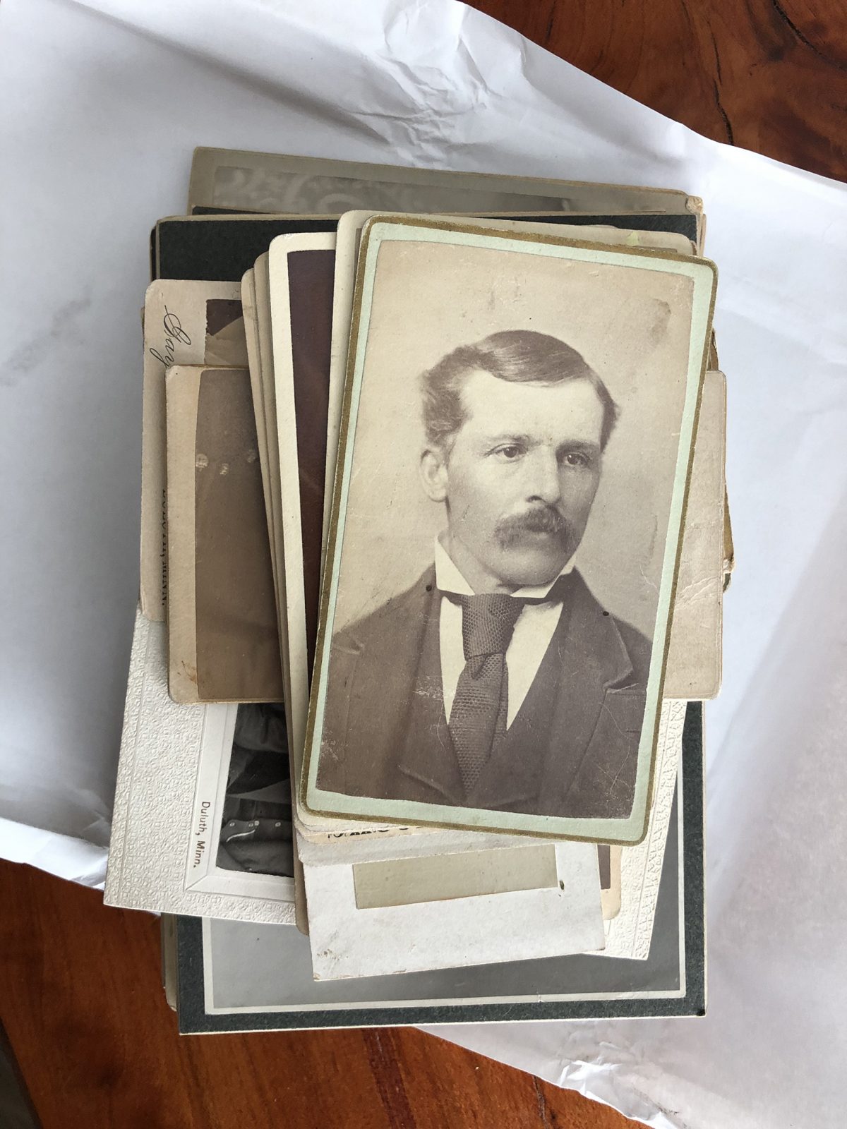 Stack of antique photographs made by Minnesota photographers