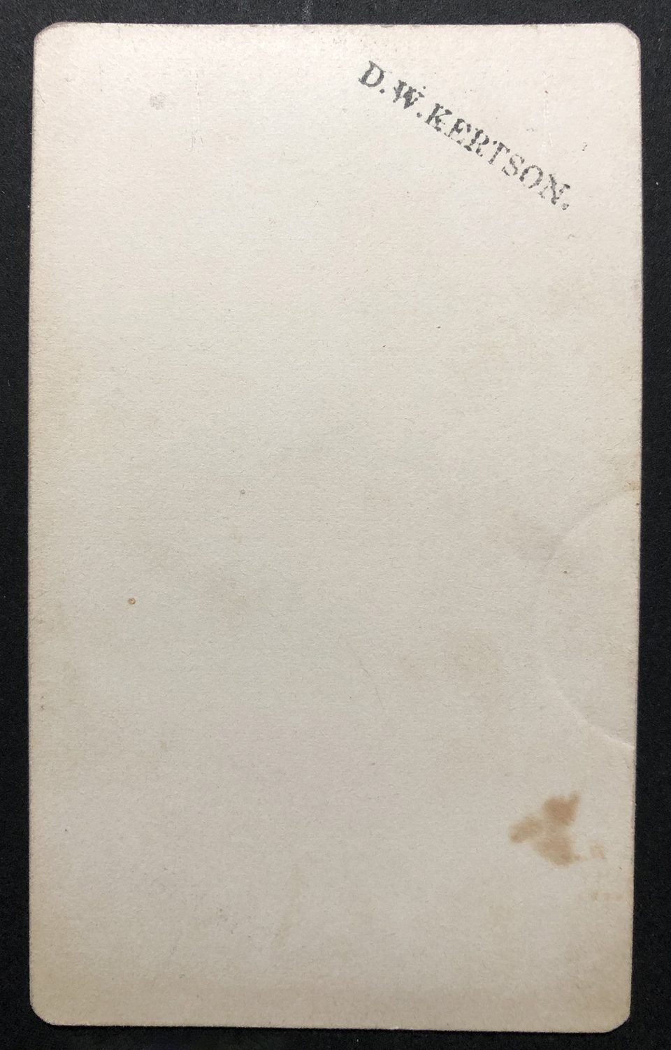 The back side of the D.W. Kertson photograph reveals only a small stamp of his name in black ink.