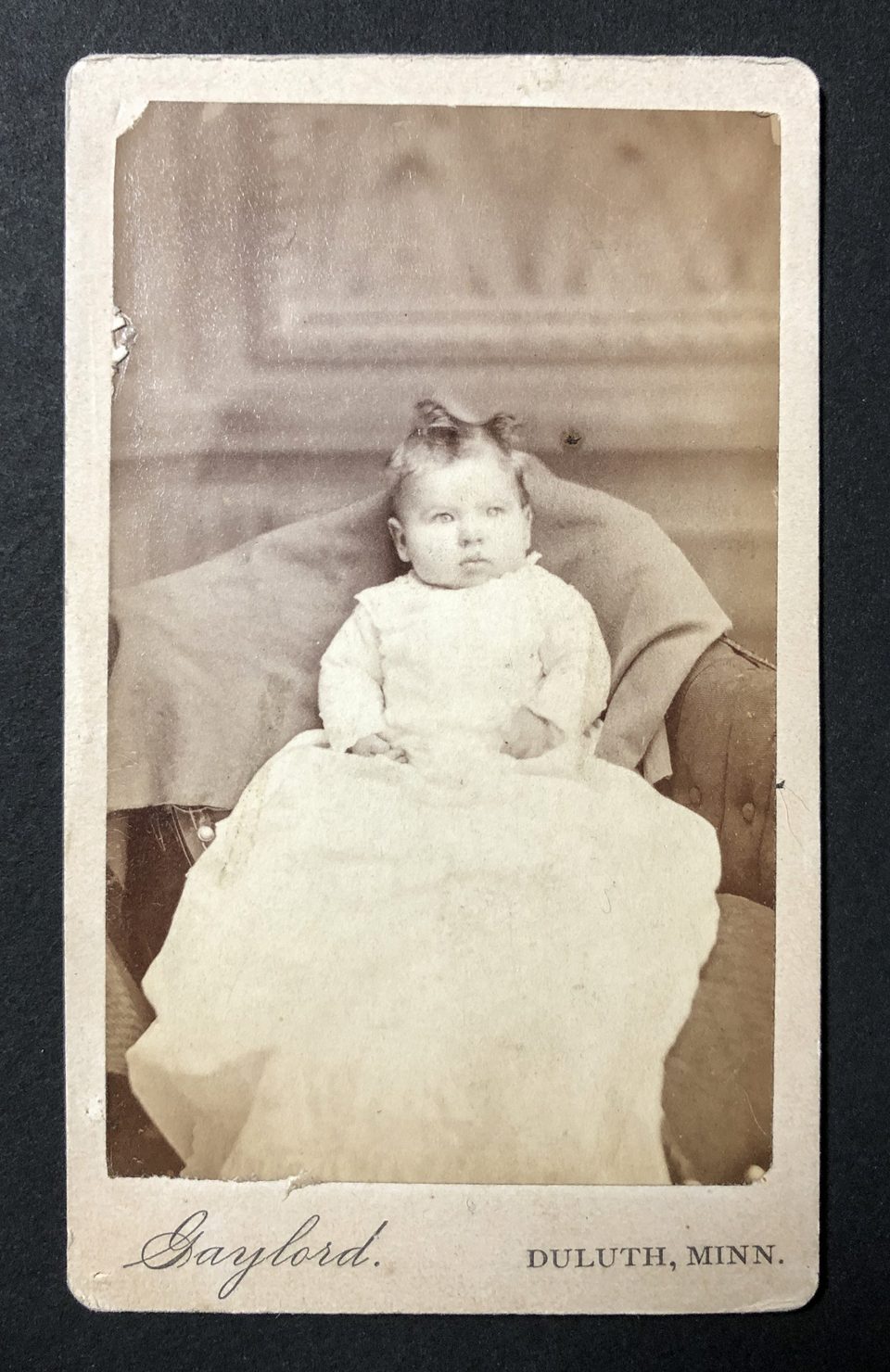 Portrait of an infant girl in a long gown made by the Gaylord studio of Duluth