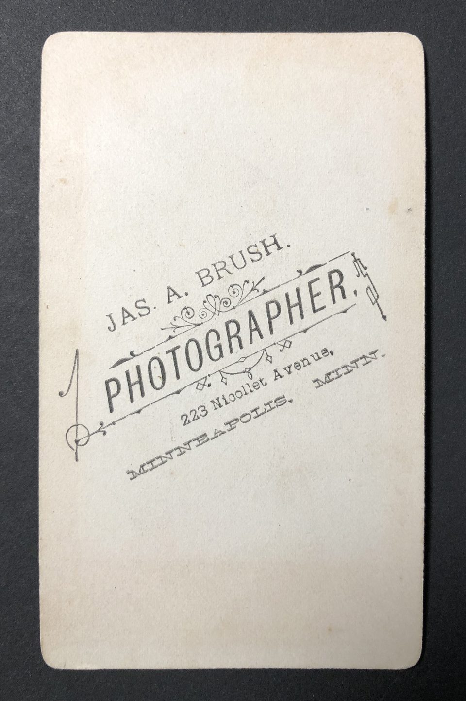 The backside of this portrait gives us another address for photographer J.A. Brush