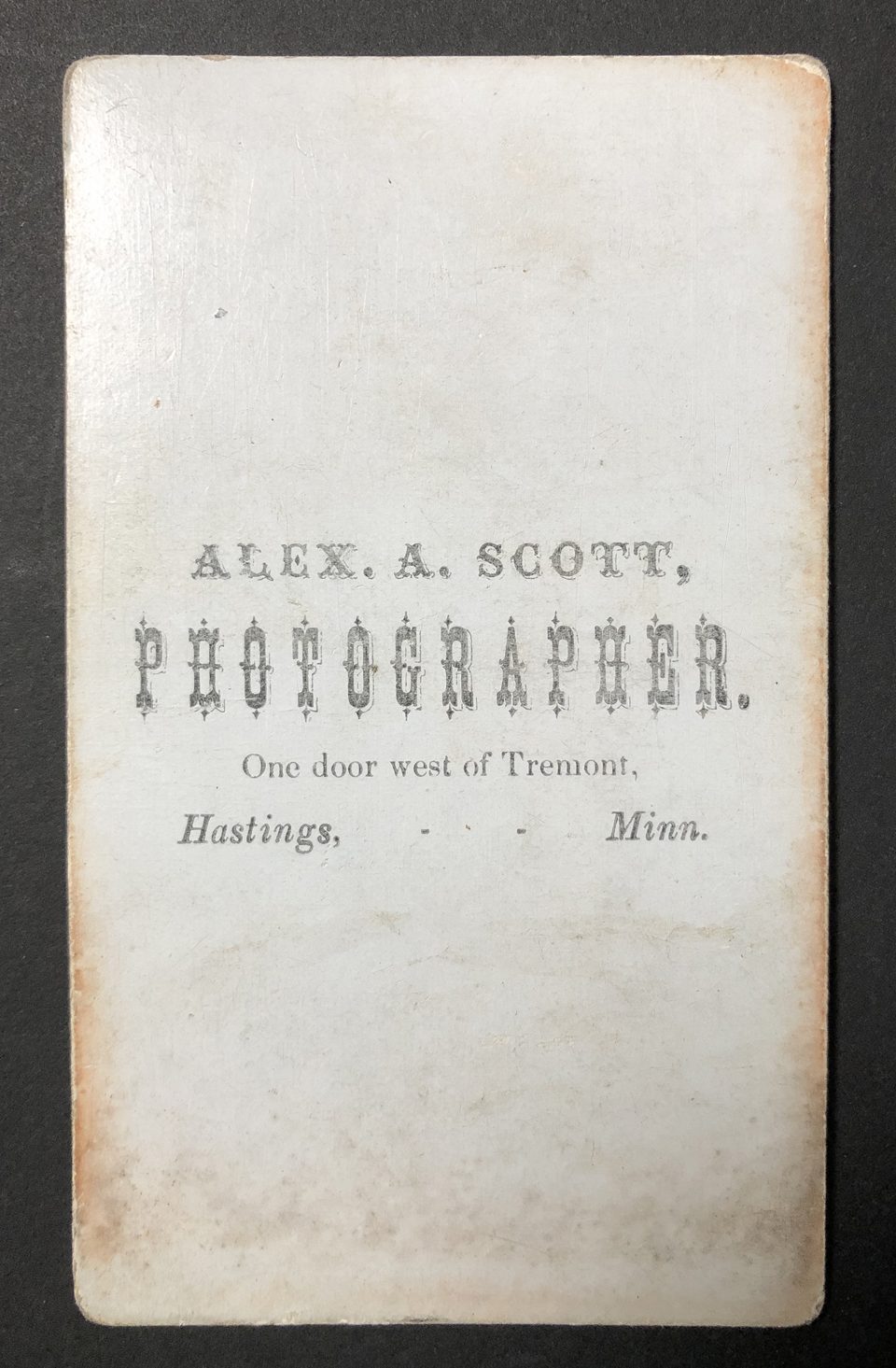 The verso of this carte de visite says "Alex A. Scott, Photographer. One door west of Tremont, Hastings, Minn."