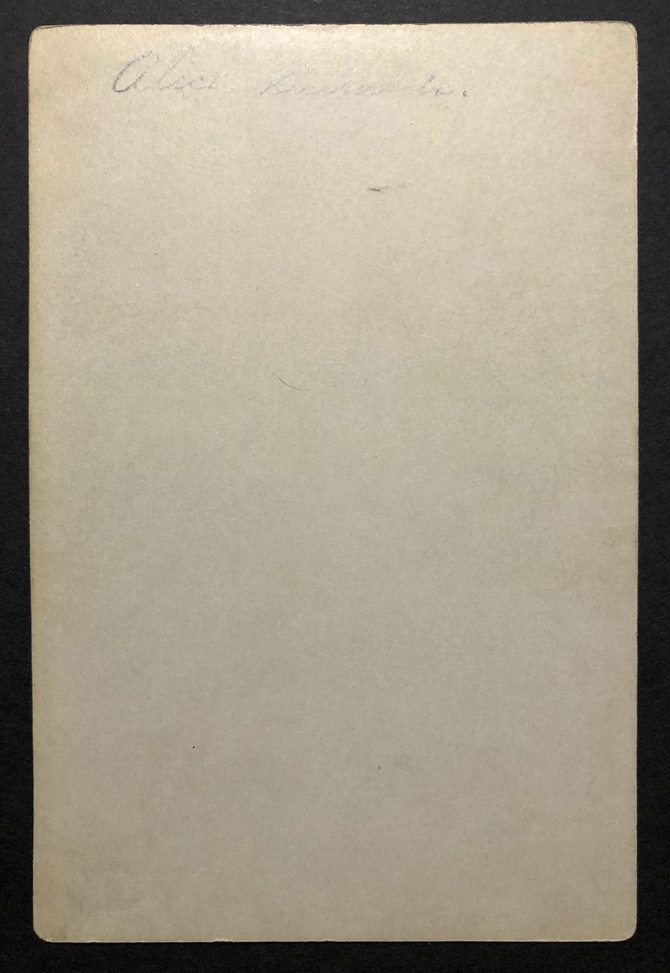 The blank back of the cabinet card features a faint name written in pencil that appears to say, "Alice Richards.," although it's very difficult read.