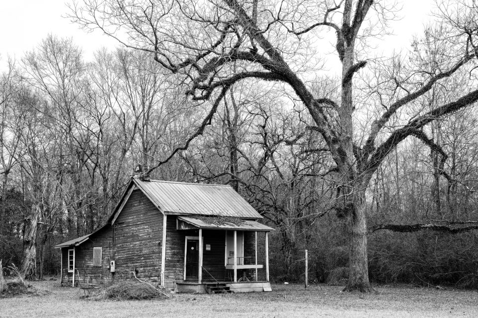 Small abandoned house in Newbern, Alabama - Black and White Photograph by Keith Dotson.