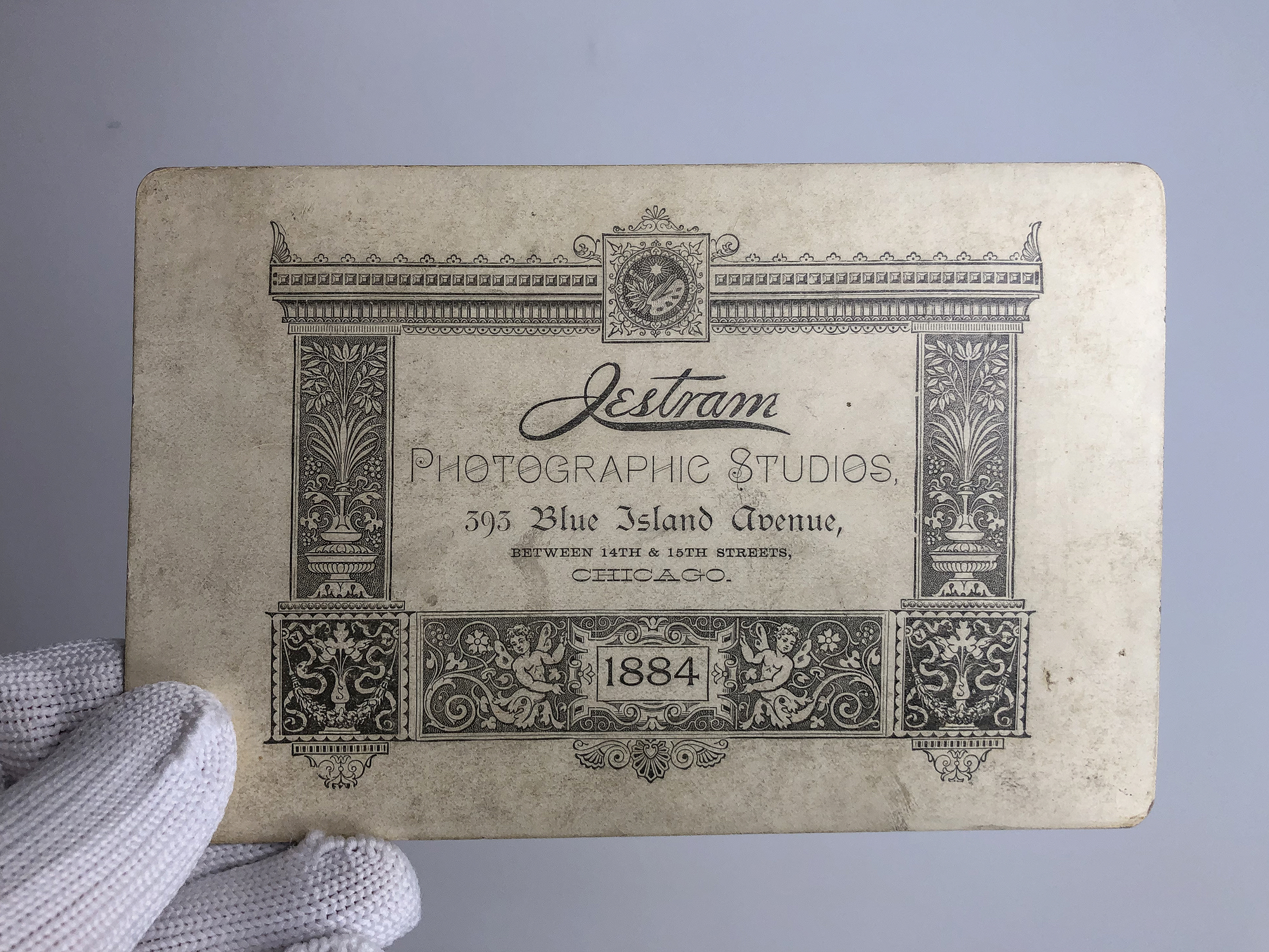 The imprint on the back of Henry Jestram's 1884 cabinet card says Jestram Photographic Studios, 393 Blue Island Avenue,
Between 14th & 15th Streets, Chicago. 1884