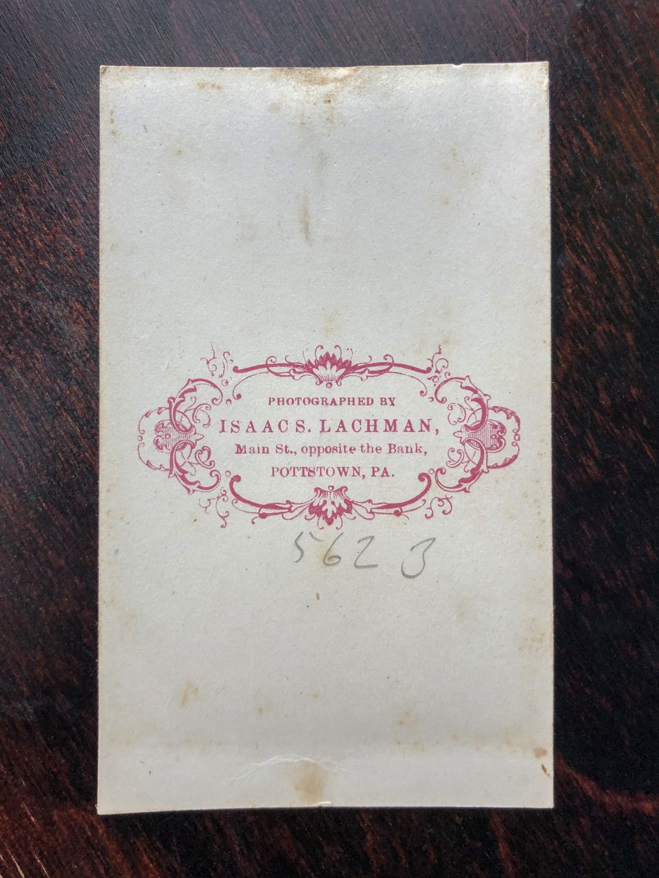 The back of this CDV photograph shows the imprint in red ink of Pottstown-based photographer Isaac S. Lachman. His studio was located on Main Street, across from the bank. In pencil, we see the handwritten number 5623, which probably corresponded to the negative number for reprints.