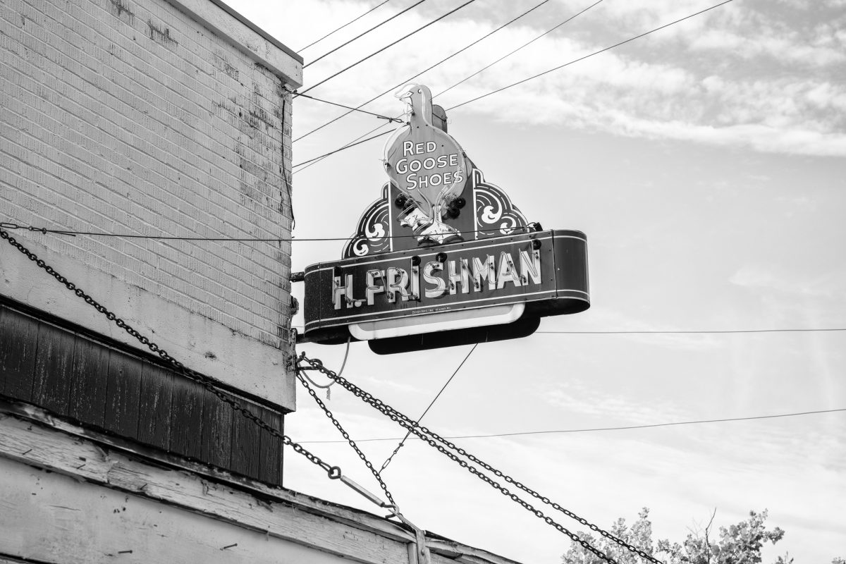 Fine art photographer tells the history of the vintage neon sign for Red Goose Shoes in Port Gibson