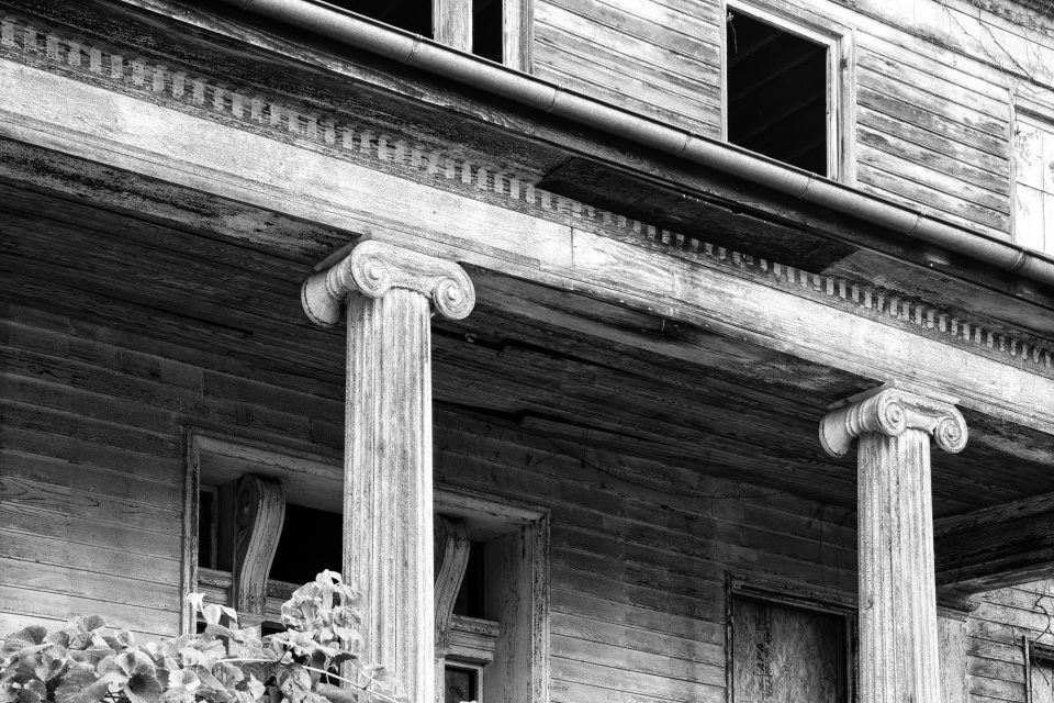 Front of the historic Judge Mark Bird house, built 1840 in Woodstock, Virginia. Black and white photograph by Keith Dotson. Buy a fine art print here.