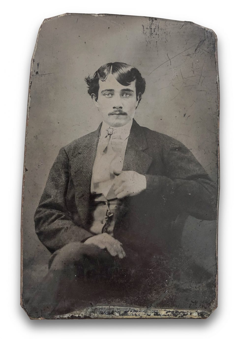 Tintype portrait of a handsome blue-eyed young man probably made in the 1850s or 1860s, the heyday of tintype use.