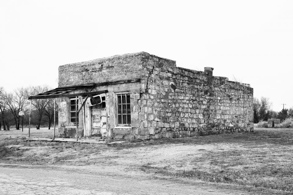 Black and white photograph of the old Abe Lincoln Trading Company, also known as the Last Chance Bar and the Juke Joint, in Clearview, Oklahoma.