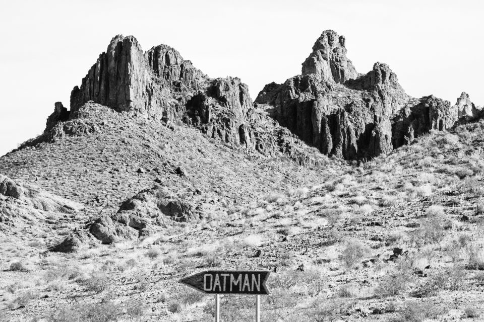 The sign to Oatman. Black and white photograph by Keith Dotson.