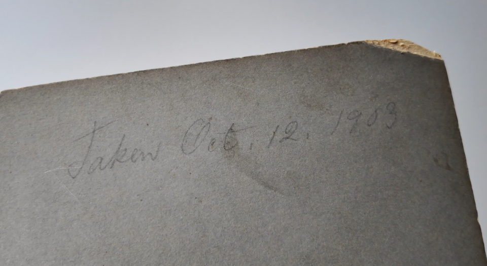 Inscription on the back that says "Taken Oct. 12, 1903."