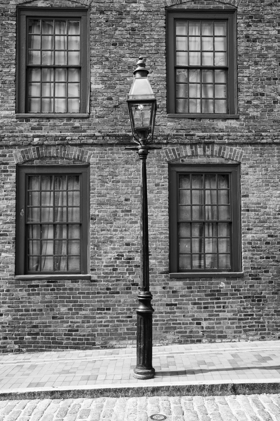Street Lamp on a Cobblestoned Street in Boston - Black and White Photograph by Keith Dotson. Buy a fine art print here.
