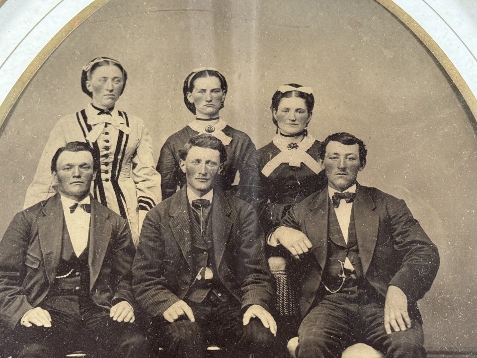A close-up look at a group of six well-dressed young people, three brothers and their three sisters.
