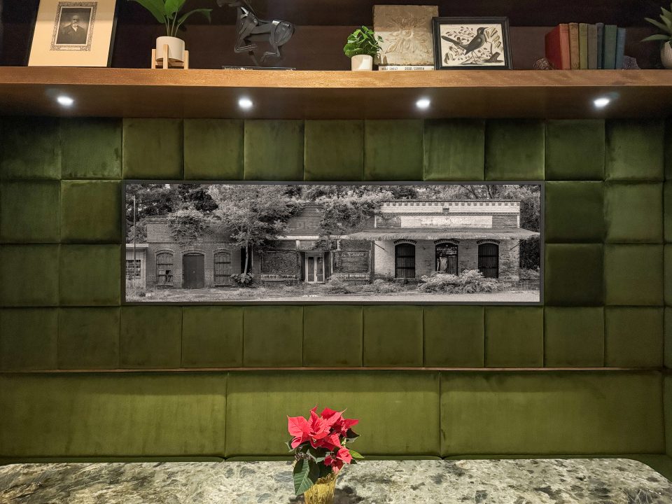 The center panel features a very wide and slightly cropped portrait of a ghost town street of abandoned buildings discovered in the American South. Buy a fine art print here.