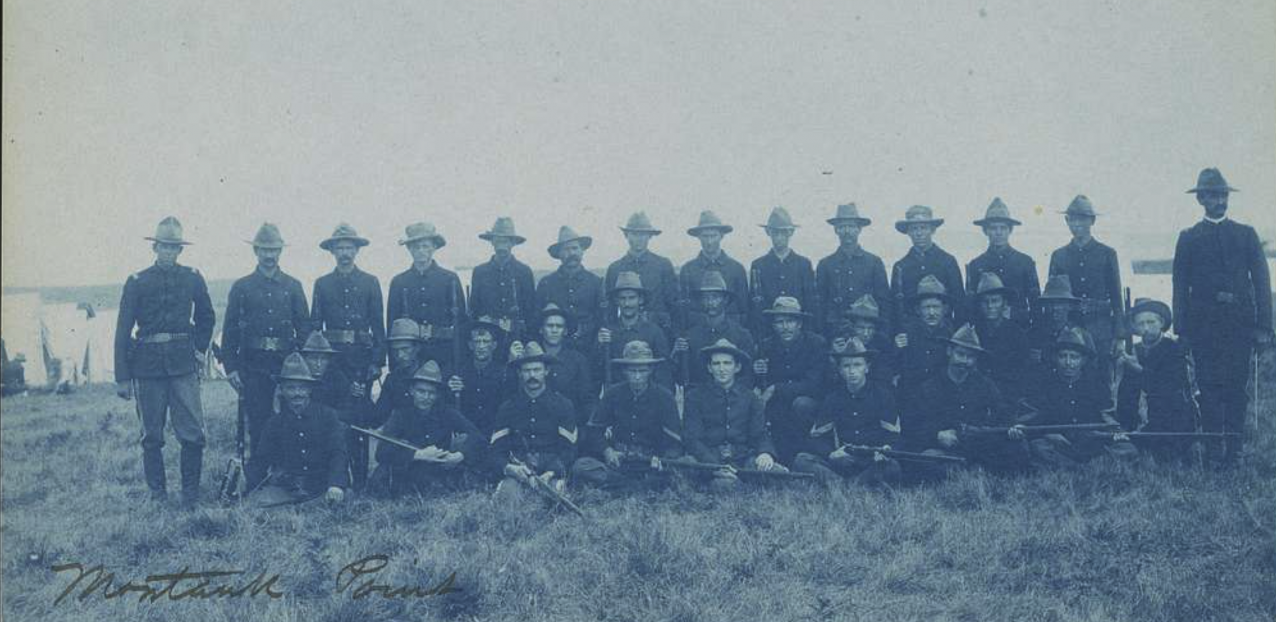 Photograph showing a group picture of Company M troop, Montauk Point, New York