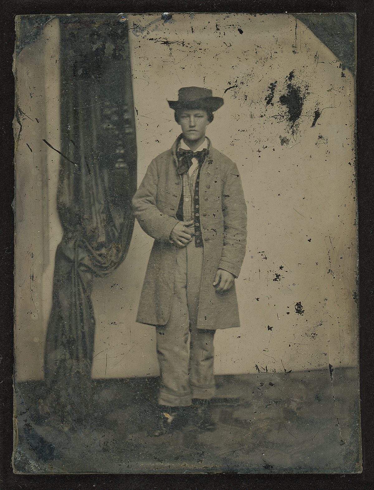 1860s-era quarter-plate ambrotype portrait of a young man in a suit