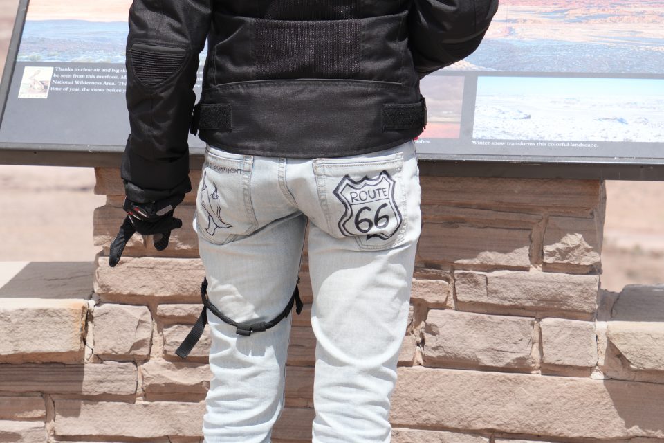 Am international tourist wears the iconic Route 66 highway shield on her back pocket. Photo by Teena Young.