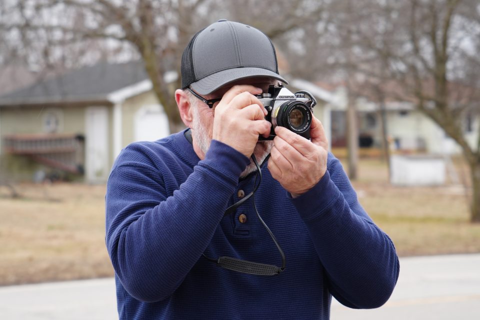 Photographer Keith Dotson makes a photograph on Route 66 in a small town in Illinois. Photo by Teena Young.