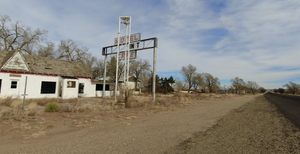 An image of the Texas Longhorn Motel in ruins in December 2021. At far right can be seen the blacktop of Route 66, rarely driven in now in comparison to 1967 when Tom Gentle made his photograph.
