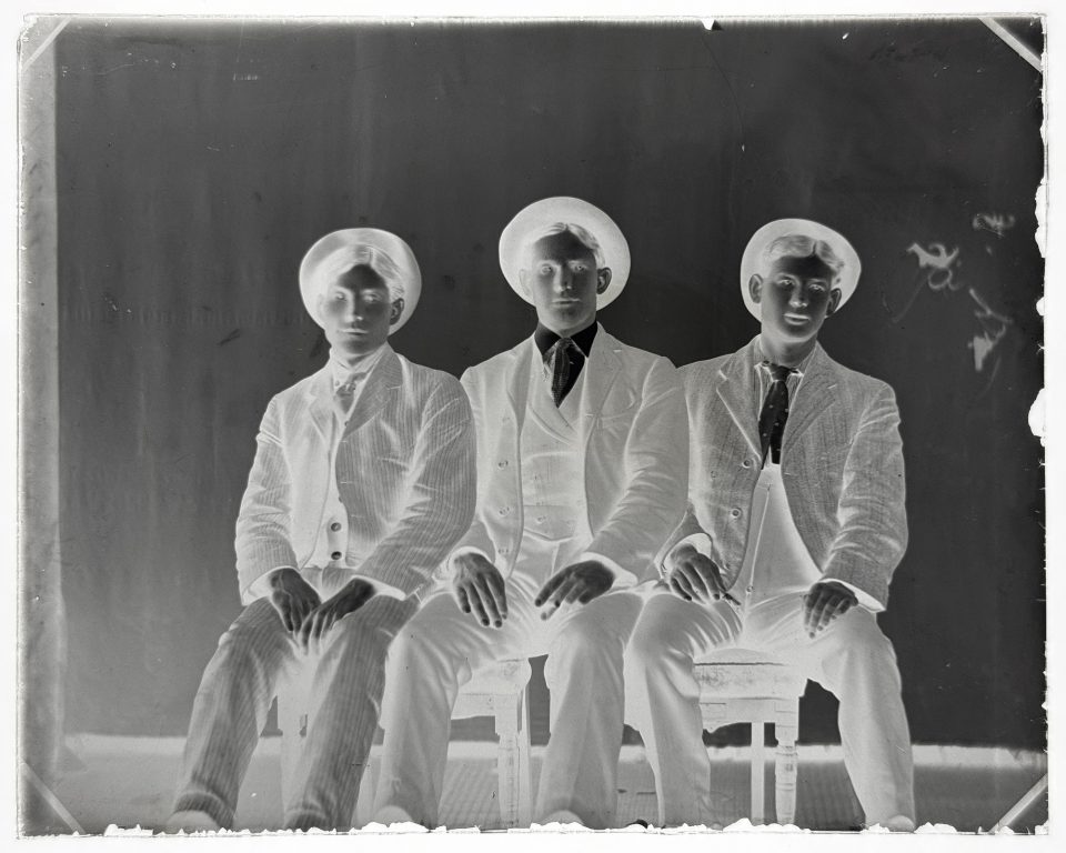 Here's a photograph of three young men -- two of them look like they could be brothers -- that AI said was dated to the 1905–1912 period, based on the style of their suits.
