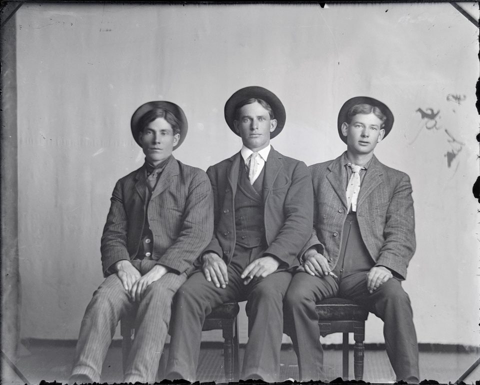 There's so much detail and dynamic range in these glass plate negatives! The portraits feel like time capsules! I have never seen a fly as long as the one on the trousers of the fella on the right!