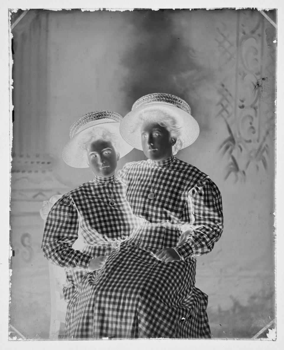 And our final portrait shows two young women in matching dresses -- and oh my that's a lot of gingham. But it's the gingham that helped AI establish a date range of approximately 1898–1903.