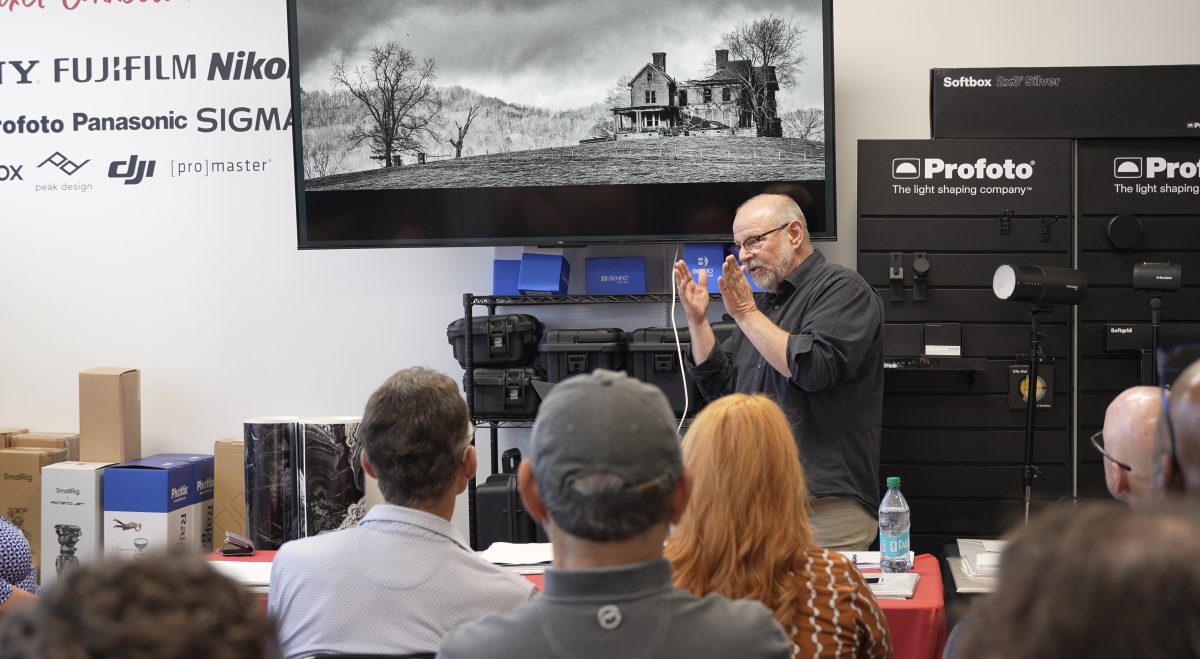 Keith Dotson discusses his photographs with a professional photography group at Pixel Connection Camera Store in nashville on July 14, 2026.