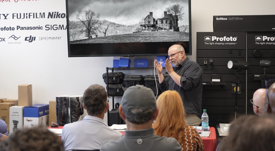 Keith Dotson discusses his photographs with a professional photography group at Pixel Connection Camera Store in nashville on July 14, 2026.