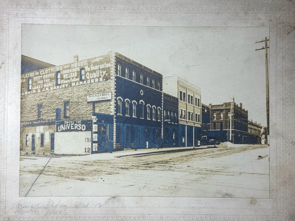 Historic photograph of Main Street in Chanute, Kansas. The 5 x 7-inch image shows historic buildings and several wall ads that helped me place the timeframe to approximately 1907.
